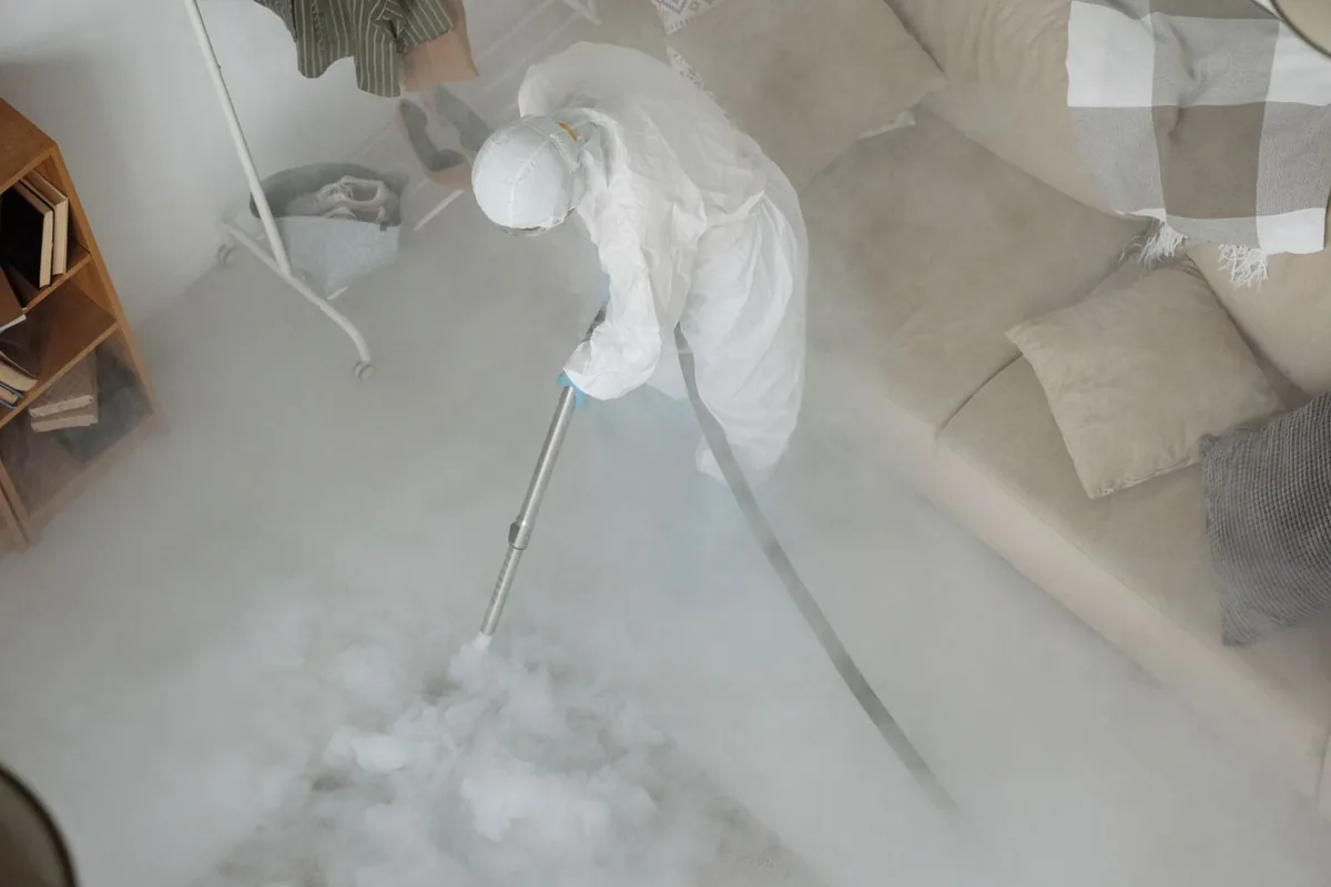 Biohazard cleanup technician in protective equipment, Lexington, MN